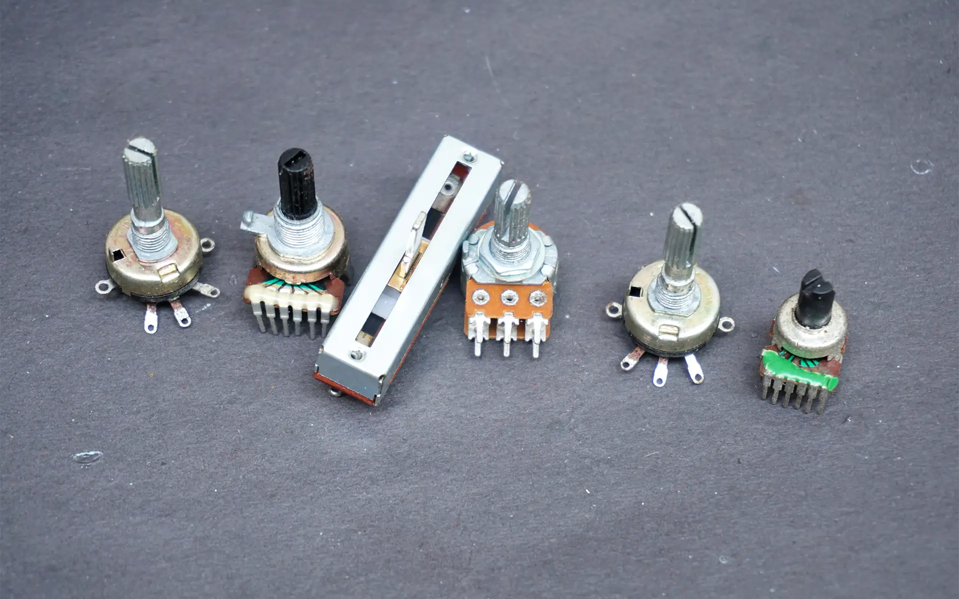 Different types of potentiometers on a table