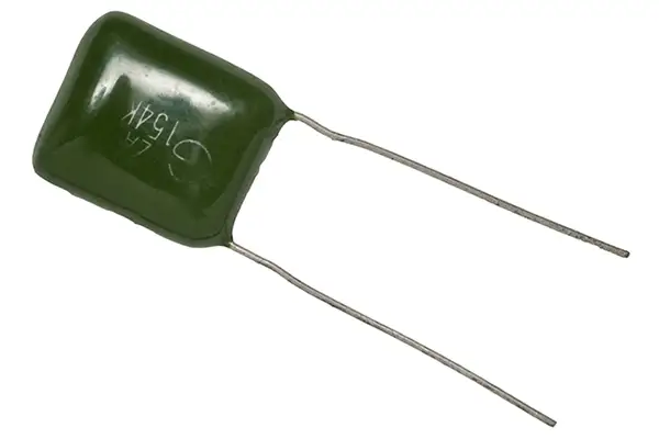 A dark green ceramic capacitor on a white background