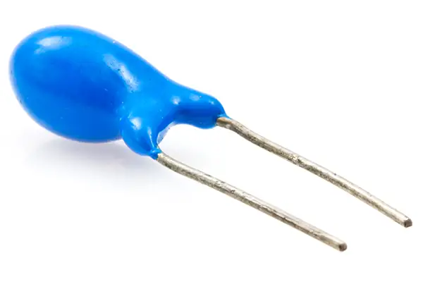 A blue tantalum capacitor on a white background