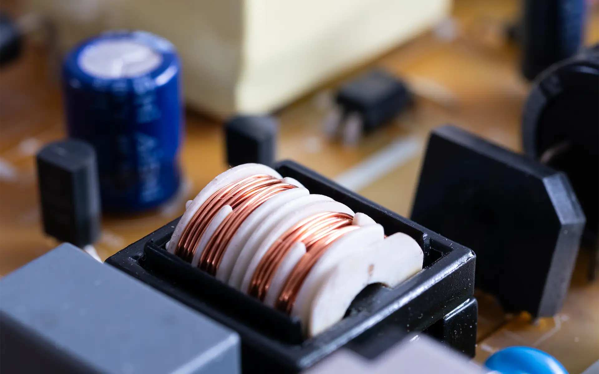 Close-up of electronic components in an application showing an EMI/RFI filter with a plastic core