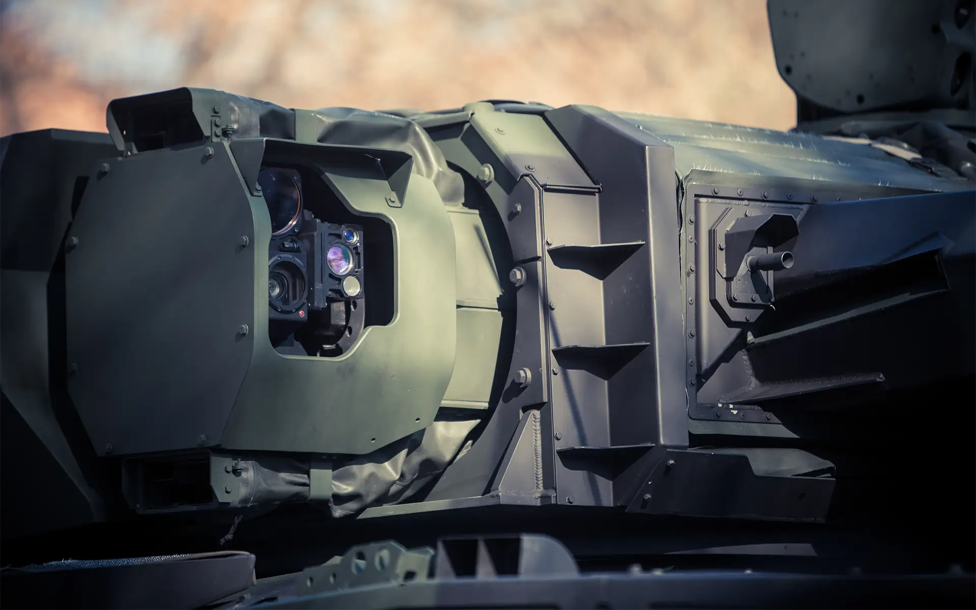 An optical sensor mounted on a military vehicle