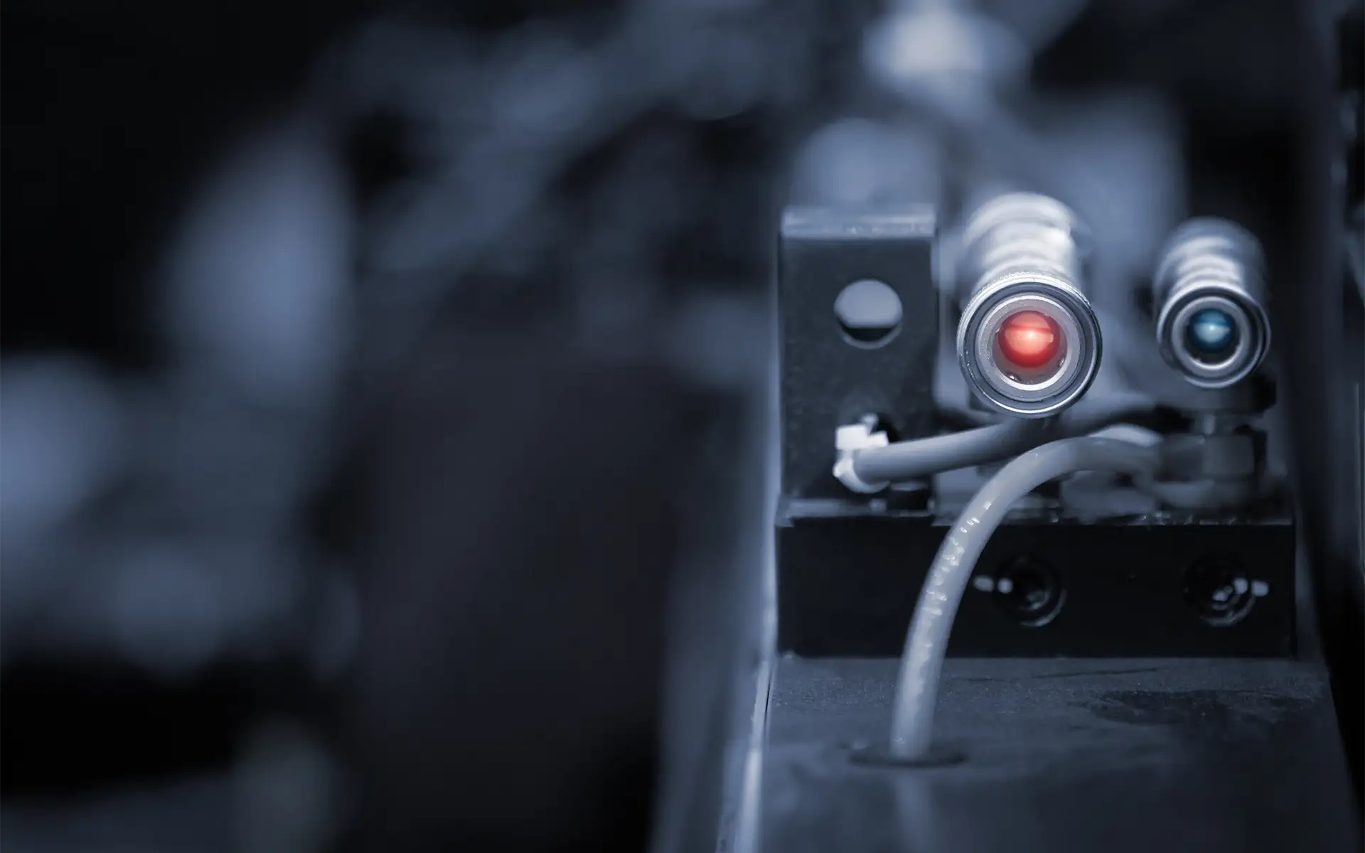 A photoelectric sensor on a factory machine for distance detection